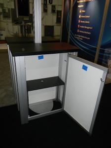 RENTAL:  RE-2008 10' x 20' Design with Arch Canopy, Double-Sided Kiosk using RE-1227 Small Rectangular Counters with Locking Doors & Interior Shelves -- Image 3