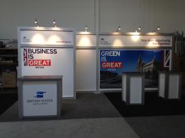 Booth Size: 10' x 20' Custom Hybrid Design with Storage Closet, RE-1202 Counter, and RE-1219 Pedestal -- Image 1