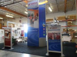 VK-5077 Island Exhibit with Custom Counters, Tension Fabric Graphics, and Wave Canopy -- Image 1