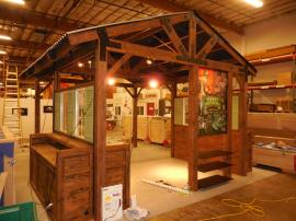 Custom Wood Fabrication Island Display with Storage, Ceiling, A/V, and Lighting -- Image 1