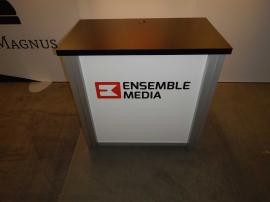 RENTAL: Inline Exhibit with SEG Fabric Graphic, Halogen Arm Lights, and RE-1202 Counter -- Image 4