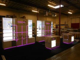 Custom Inline Exhibit with Shelving, Counters, Product Displays, Storage, Lightboxes, and Programmable LED RGB Lighting -- Image 4
