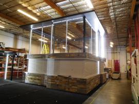 Custom 40 x 40 Island with Extensive Slatwall, Storage, LED Lightboxes, and Canopy Ceilings