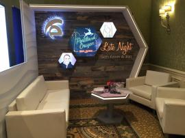 Custom Wood Fabrication and Gravitee Modular Exhibit with LED Graphics, Edge Lighting, and Charging Table with Graphics