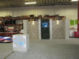 ecoSmart Sustainable Custom Inline with Modular Wall Panels, LED Sconces and Standoffs, Acrylic Signage, and Reception Counter with Locking Storage