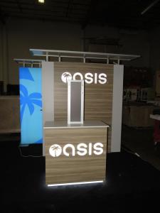 Custom Inline Lightbox Exhibit with Backlit Dimensional Logos, Custom Counters. Monitor Mounts, and Closet and Counter Storage. Reconfigures to 10 ft.