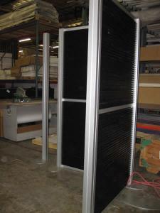 20' x 20' Island Exhibit Rental with Slatwall and Tension Fabric Header